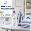 Papilion woda do prasowania obok żelazka parowego i wyprasowanych ubrań